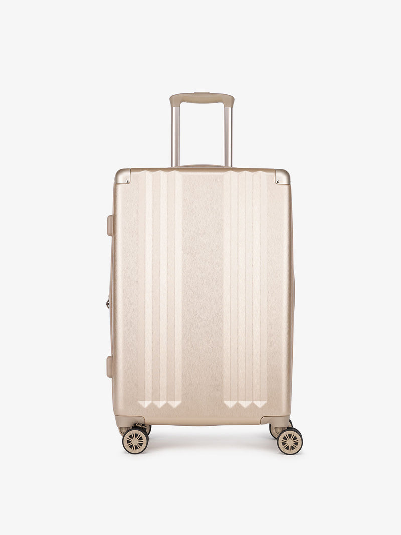 gold medium luggage as part of 3 piece luggage set