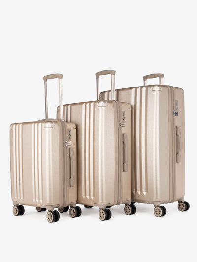 CALPAK Ambeur: 3 piece lightweight expandable gold hard shell luggage set with carry on; LAM3000-GOLD view 1