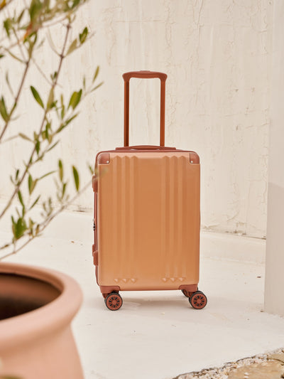 Front-facing image of CALPAK Ambeur carry-on luggage with 360 spinner wheels in copper; LAM1020-COPPER view 2