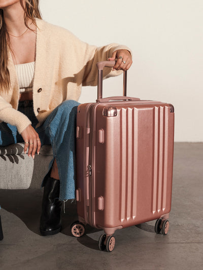 Lightweight rose gold CALPAK Ambeur 22-inch rolling spinner carry-on luggage; LAM1020-ROSE-GOLD