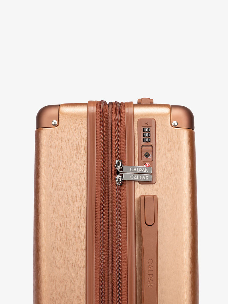 CALPAK Ambeur large sized expandable luggage with built-in TSA lock in copper