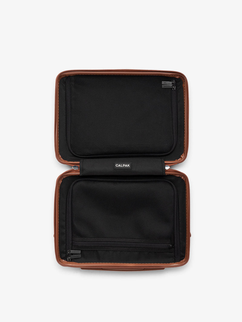 Top view of opened travel CALPAK Ambeur Vanity Case in copper