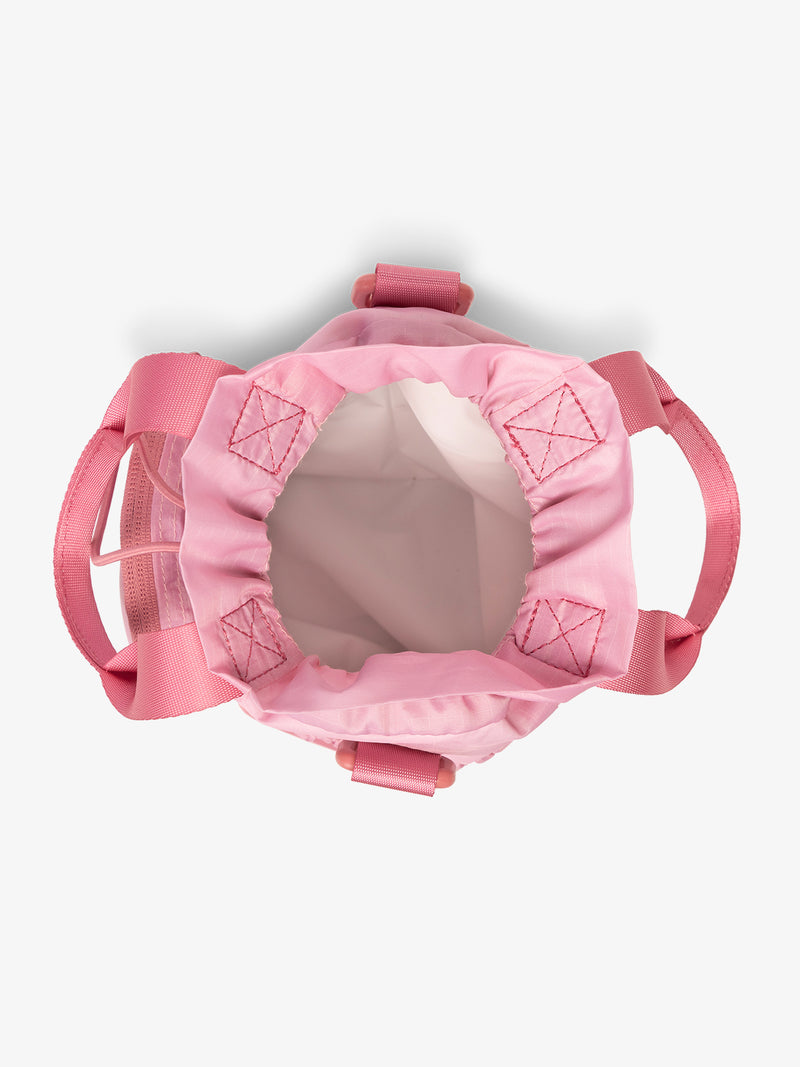 Top view with white inside fabric of CALPAK Water Bottle Holder in pink ombre Tea Rose