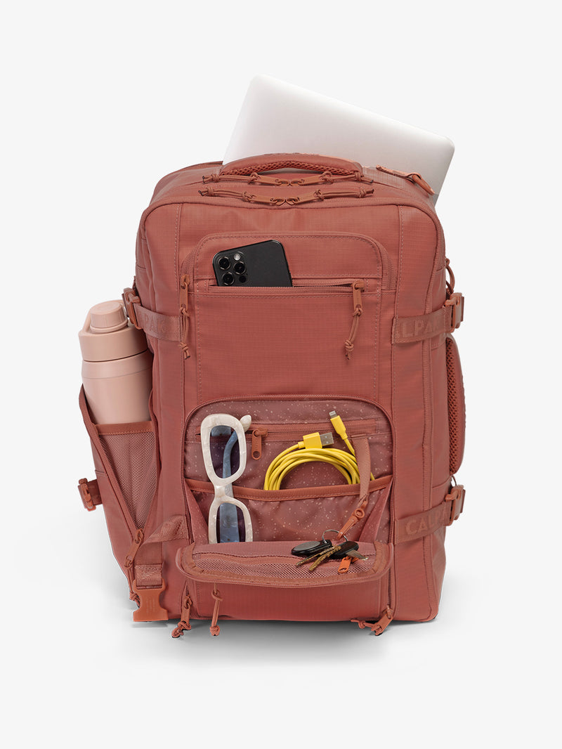 CALPAK Terra 26L Laptop Backpack Duffel in red and orange Matte Clay backpack being utilized