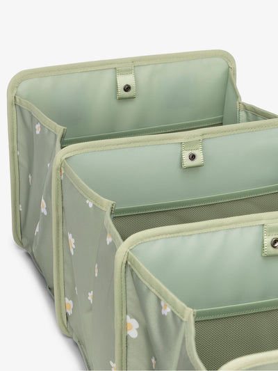 collapsible CALPAK car trunk organizer featuring compartments in green daisy