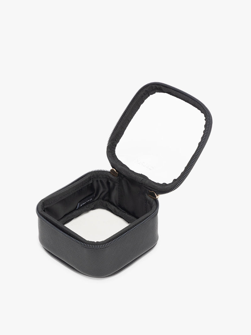CALPAK Tiny Clear Cosmetic Case in Black opened with zipper