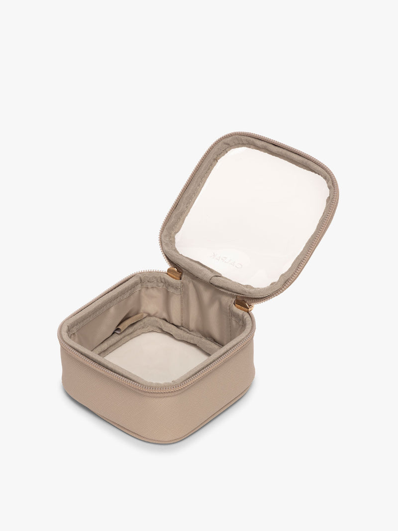 CALPAK Tiny Clear Cosmetic Case in tan Stone opened with zipper