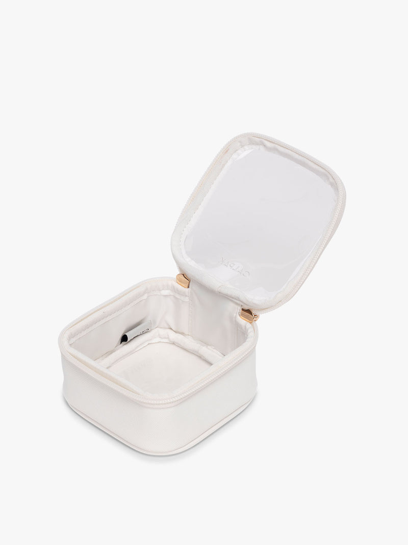 CALPAK Tiny Clear Cosmetic Case in White opened with zipper