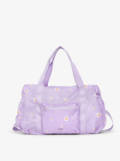 CALPAK Compakt duffel bag with removable crossbody strap and water resistant fabric in orchid fields; KDB2001-ORCHID-FIELDS