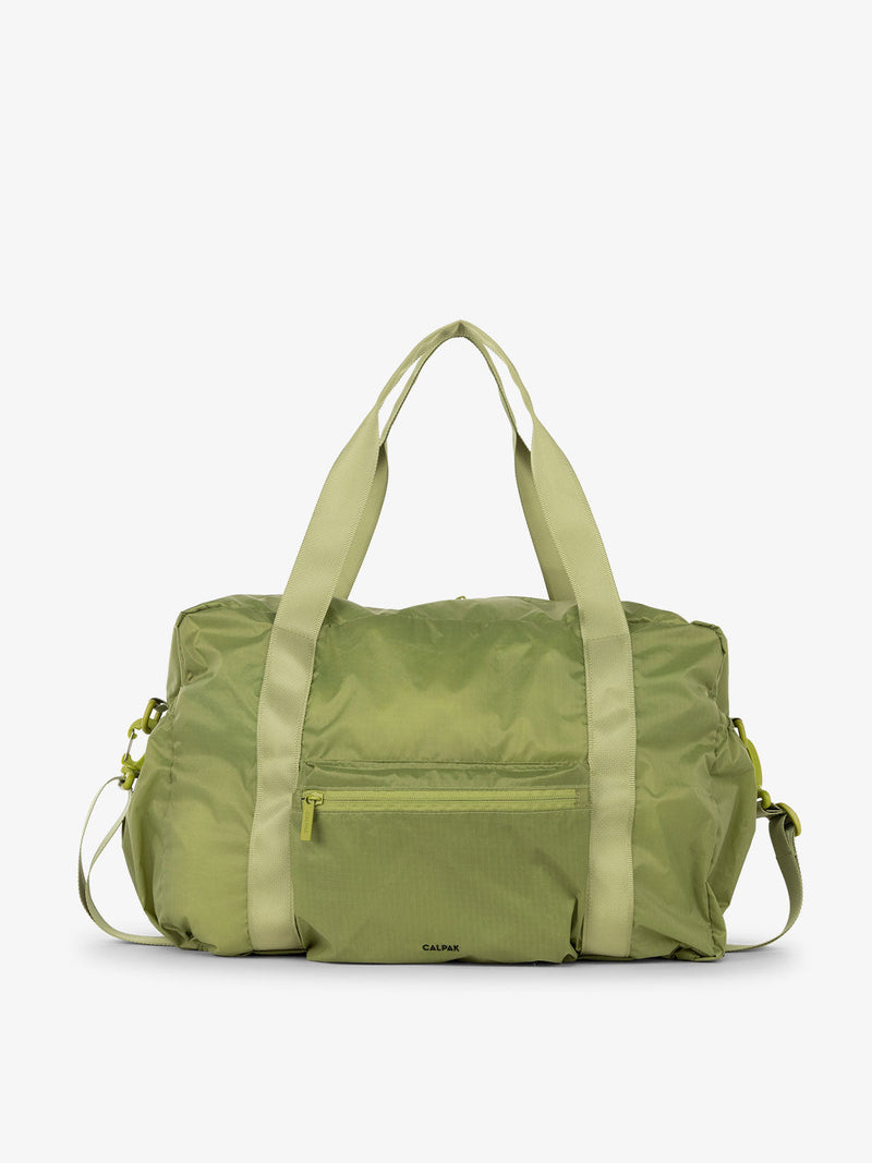 CALPAK Compakt duffel bag with removable crossbody strap and water resistant fabric in palm