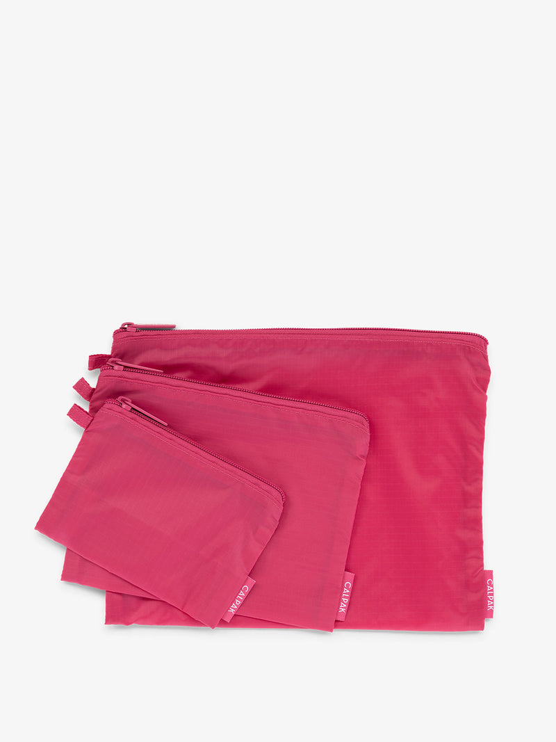 CALPAK Compakt zippered pouches in dragonfruit