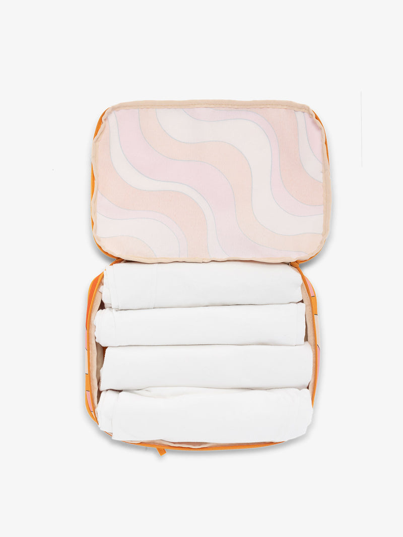 CALPAK packing cubes for travel in retro sunset