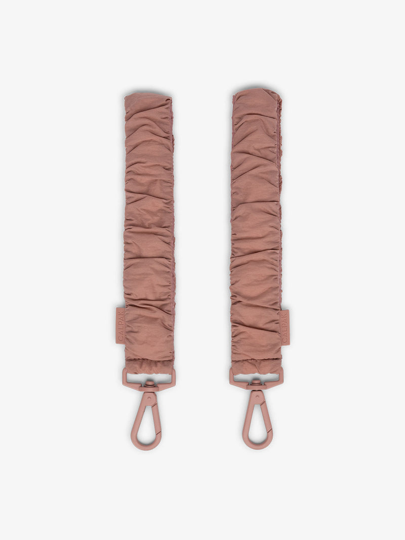 CALPAK Stroller Straps for Diaper Bag made with Oeko-Tex certified, recycled, and water-resistant materials in pink peony