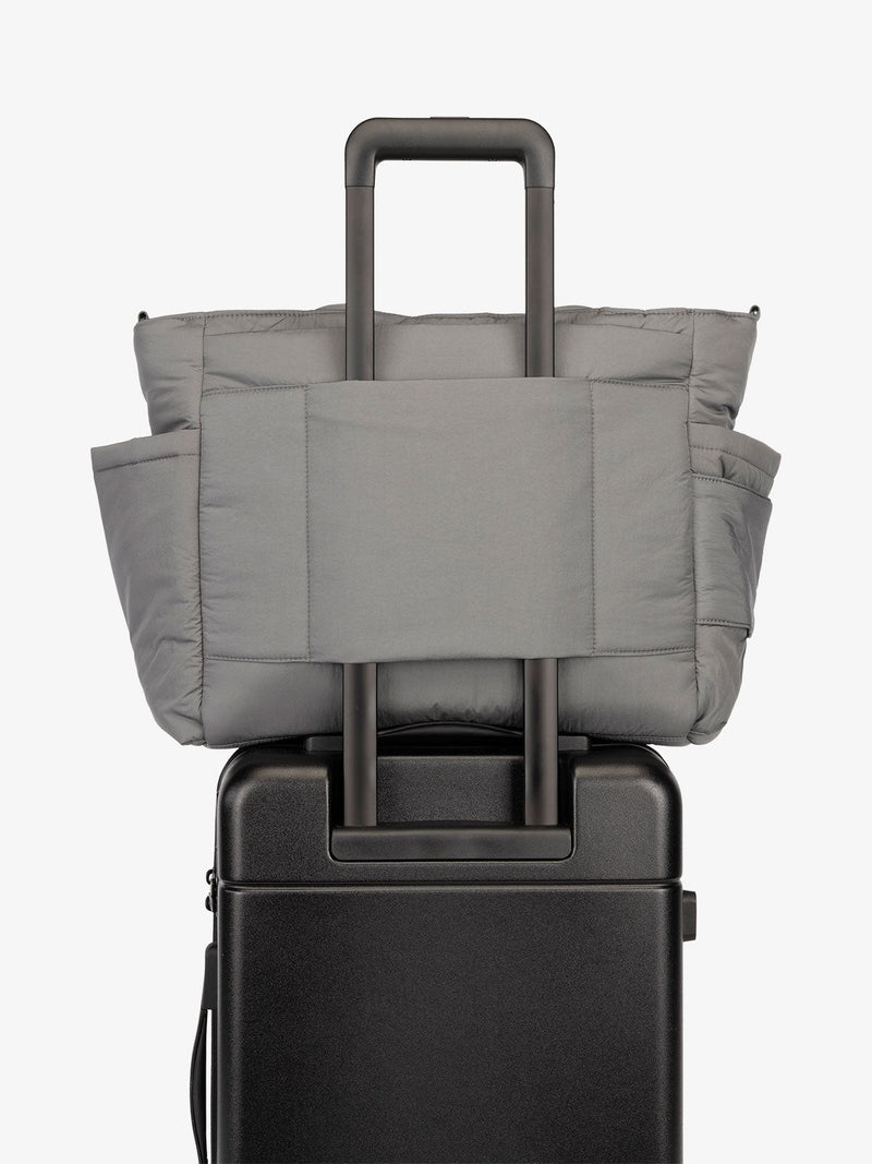 CALPAK Diaper Tote Bag with Laptop Sleeve featuring luggage trolley sleeve with back pocket in slate gray