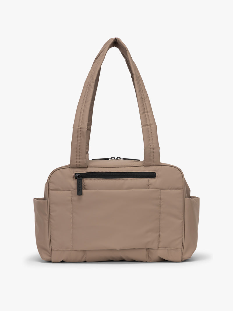 CALPAK Mini Duffel in brown Chocolate back view with zipper, puffy exterior, interior and exterior pockets, and padded shoulder straps