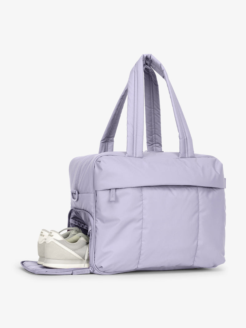 CALPAK Luka Duffel side shoe compartment shown in purple lavender Orchid