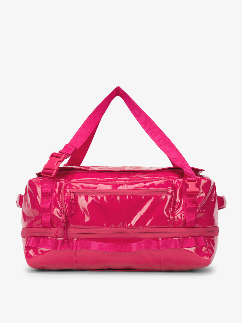 CALPAK Terra 50L Duffel Backpack in bright pink Dragonfruit