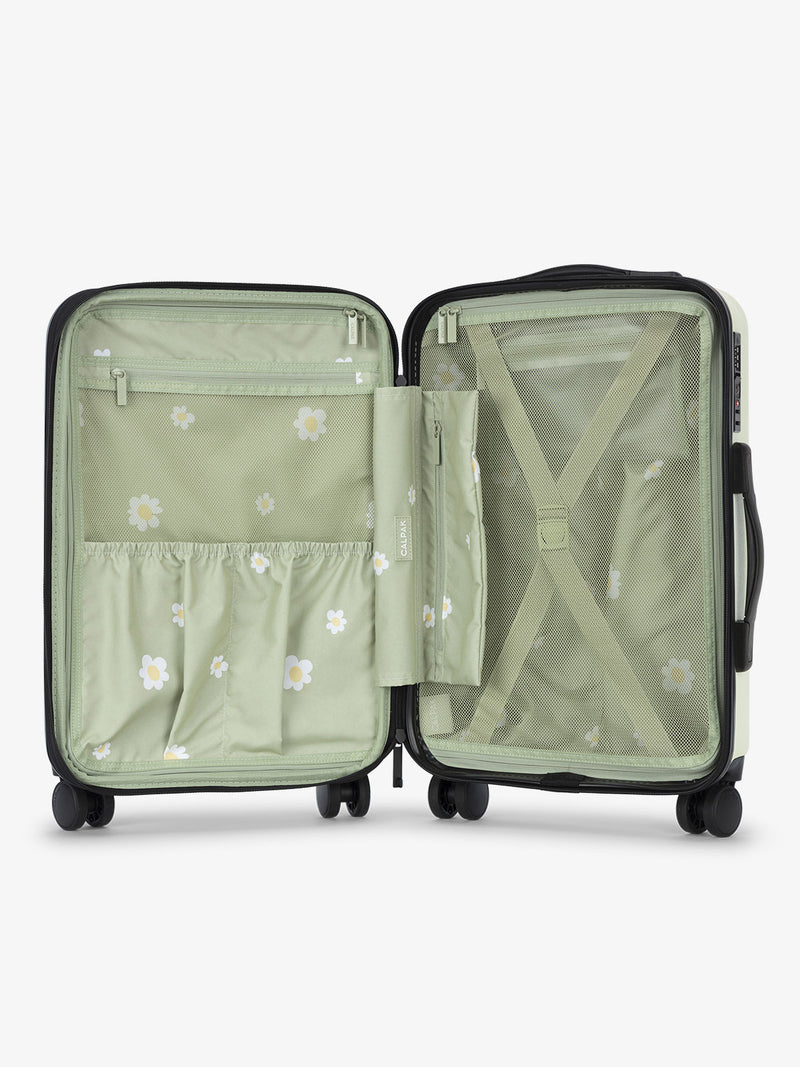 Light green daisy print CALPAK Evry Carry-On Luggage features divided compartments with interior pockets for organized packing