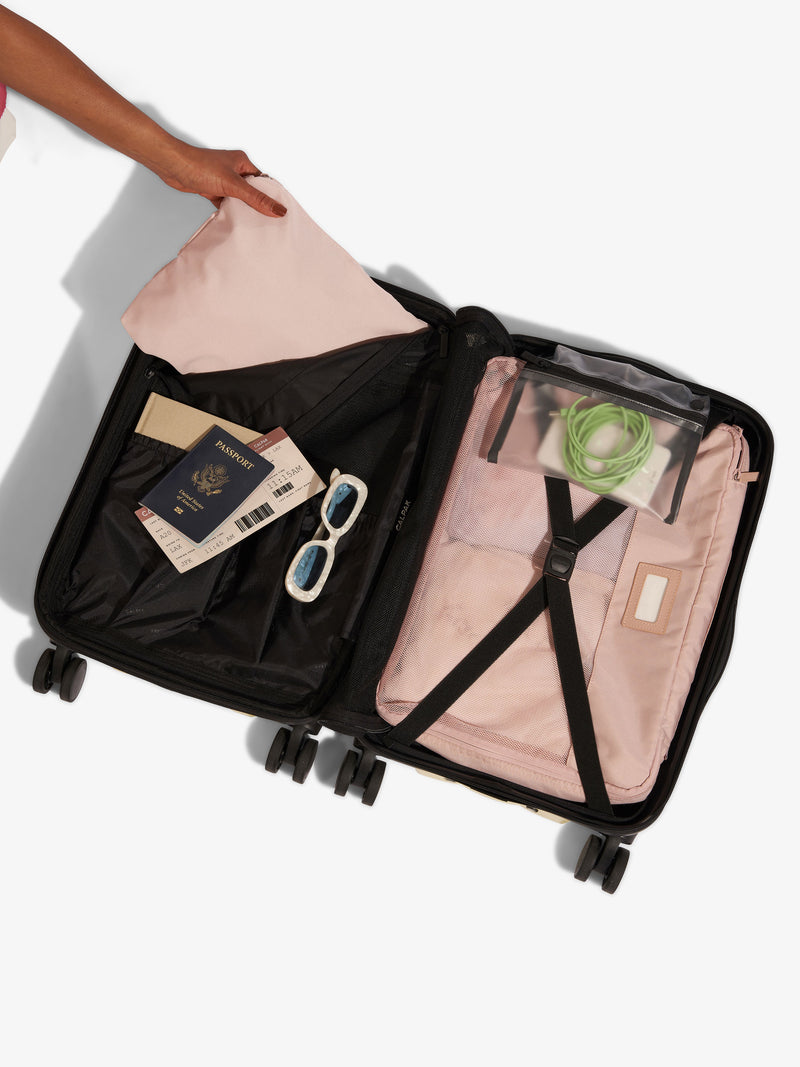 CALPAK Evry Carry-On Luggage with items inside