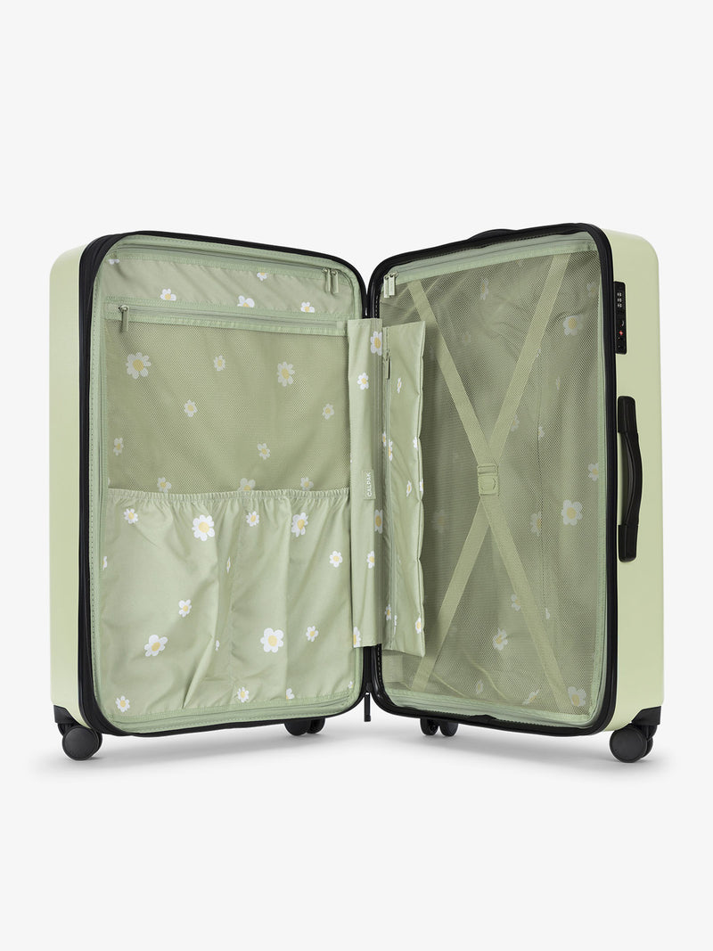 Light green daisy CALPAK Evry Large Luggage features divided compartments with interior pockets for organized packing