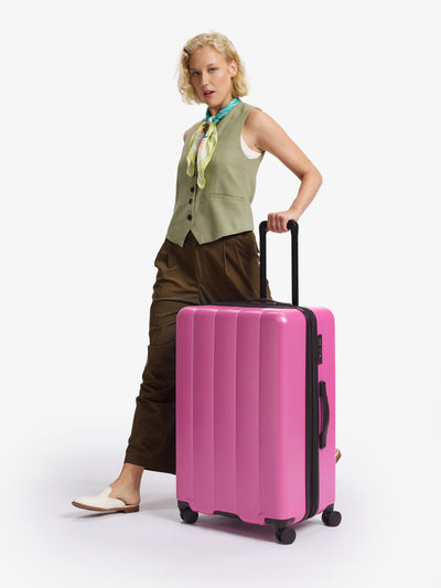 CALPAK raspberry large luggage made from an ultra-durable polycarbonate shell and expandable by up to 2; LCO1028-RASPBERRY view 2