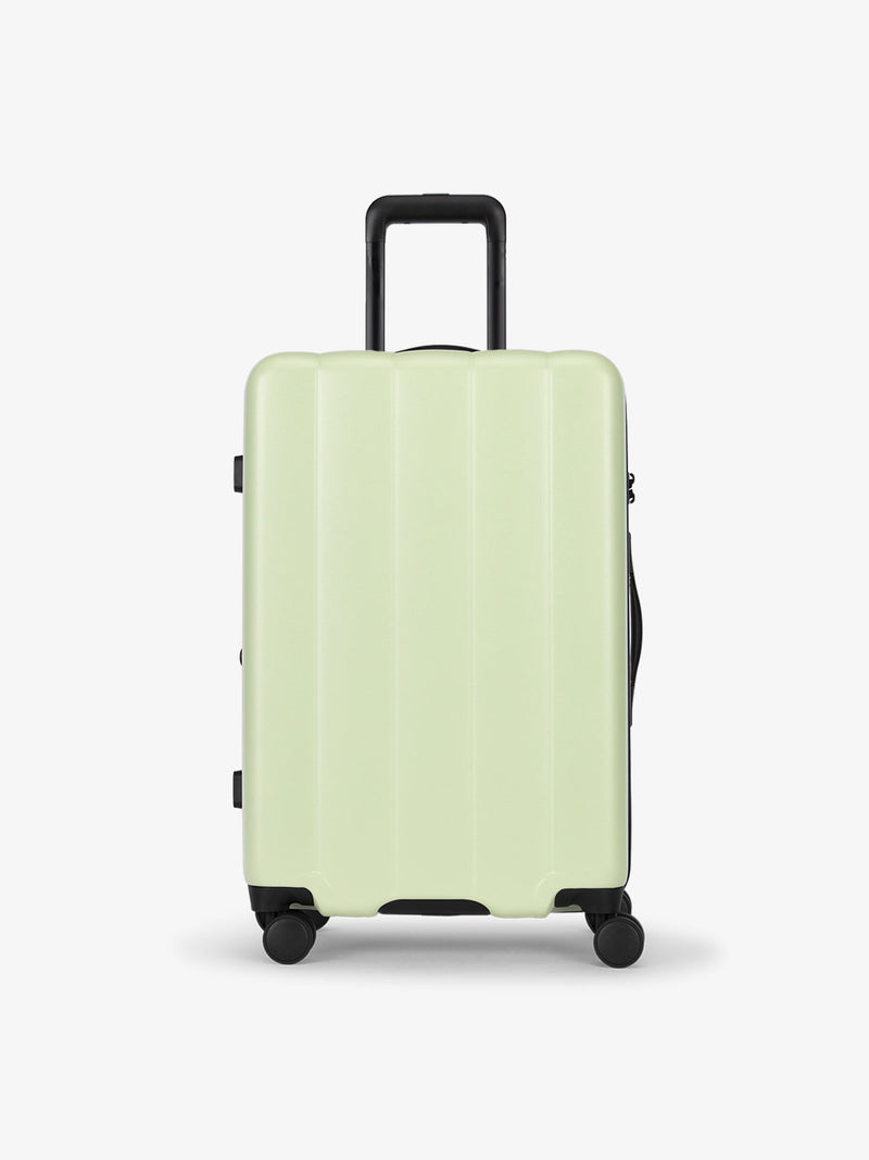 CALPAK daisy medium luggage made from an ultra-durable polycarbonate shell and expandable by up to 2"