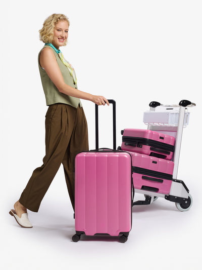 CALPAK raspberry medium luggage made from an ultra-durable polycarbonate shell and expandable by up to 2; LCO1024-RASPBERRY view 2