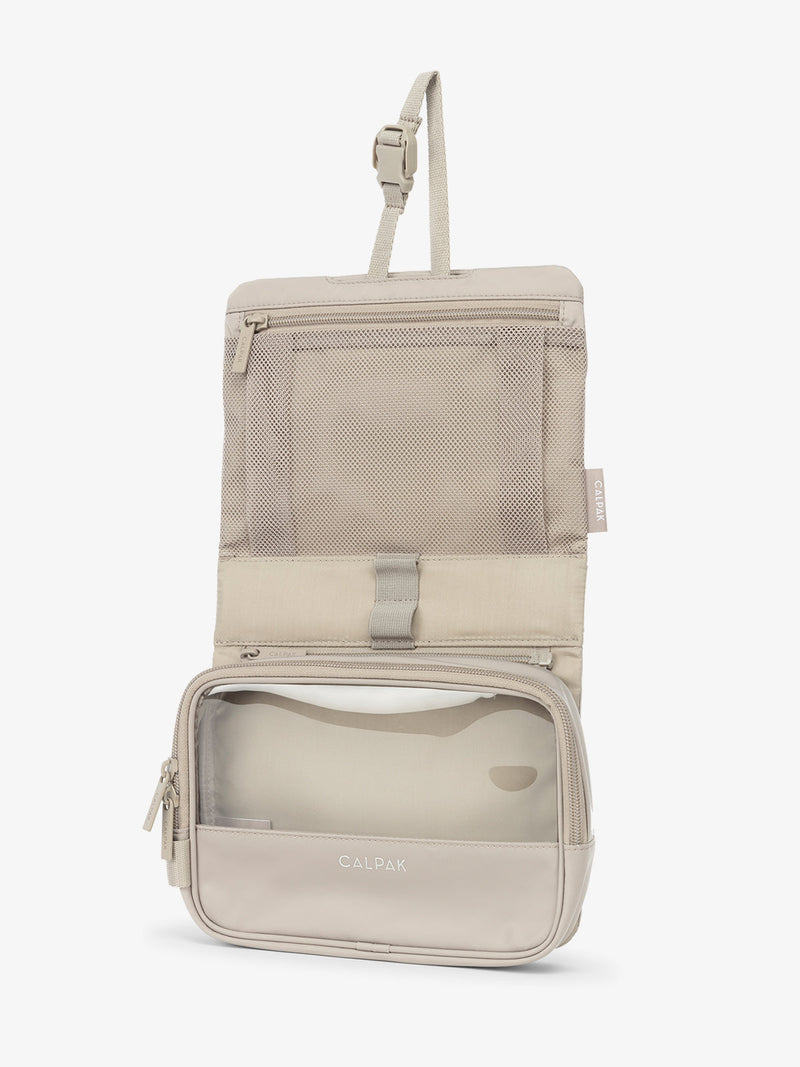 CALPAK Fit Hanging Dopp Kit with collapsible hanging hook and multiple interior mesh pockets in grayish beige