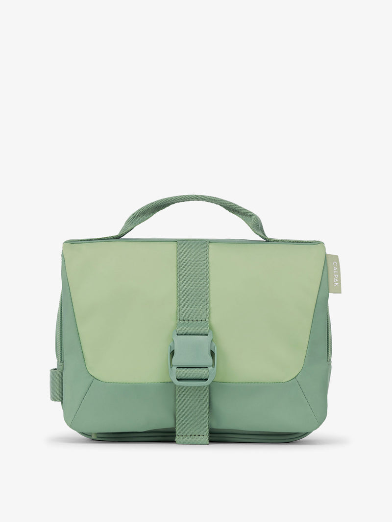 Front view of CALPAK Fit Hanging Dopp Kit made of recycled polyester and features a buckle front closure in sage