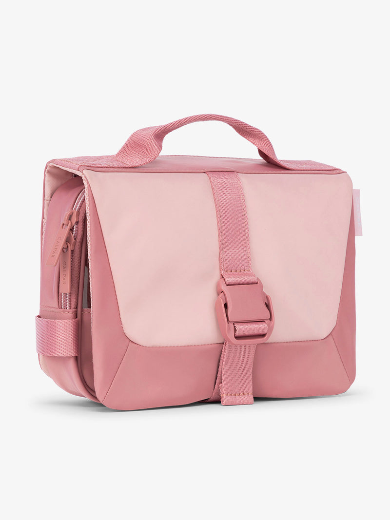 Side view of CALPAK Fit gym toiletry bag with durable carrying handle and made with 2 recycled water bottles in tea rose pink