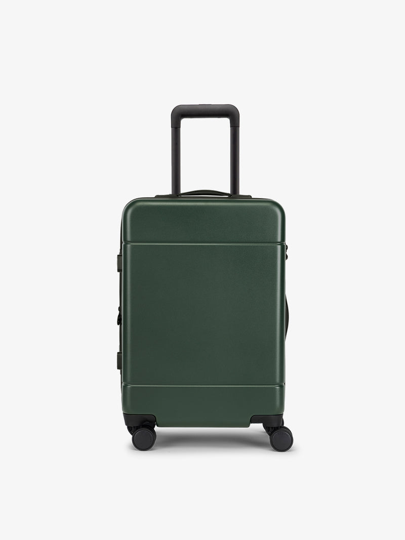 CALPAK Hue Carry-On Luggage front view in hard shell in green emerald