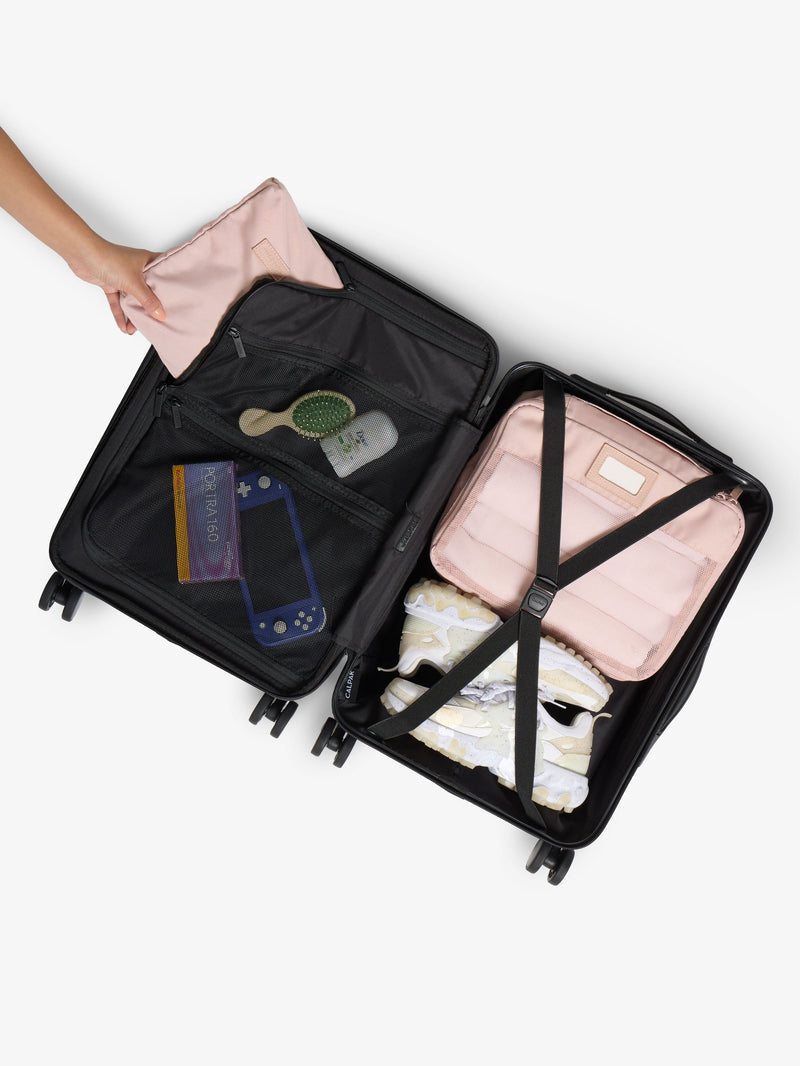 CALPAK Hue Front Pocket Carry-On Luggage with packing cubes and belongings packed within