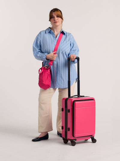 CALPAK Hue carry-on hard shell luggage with front pocket in hot pink dragonfruit; LHU1020-DRAGONFRUIT view 2