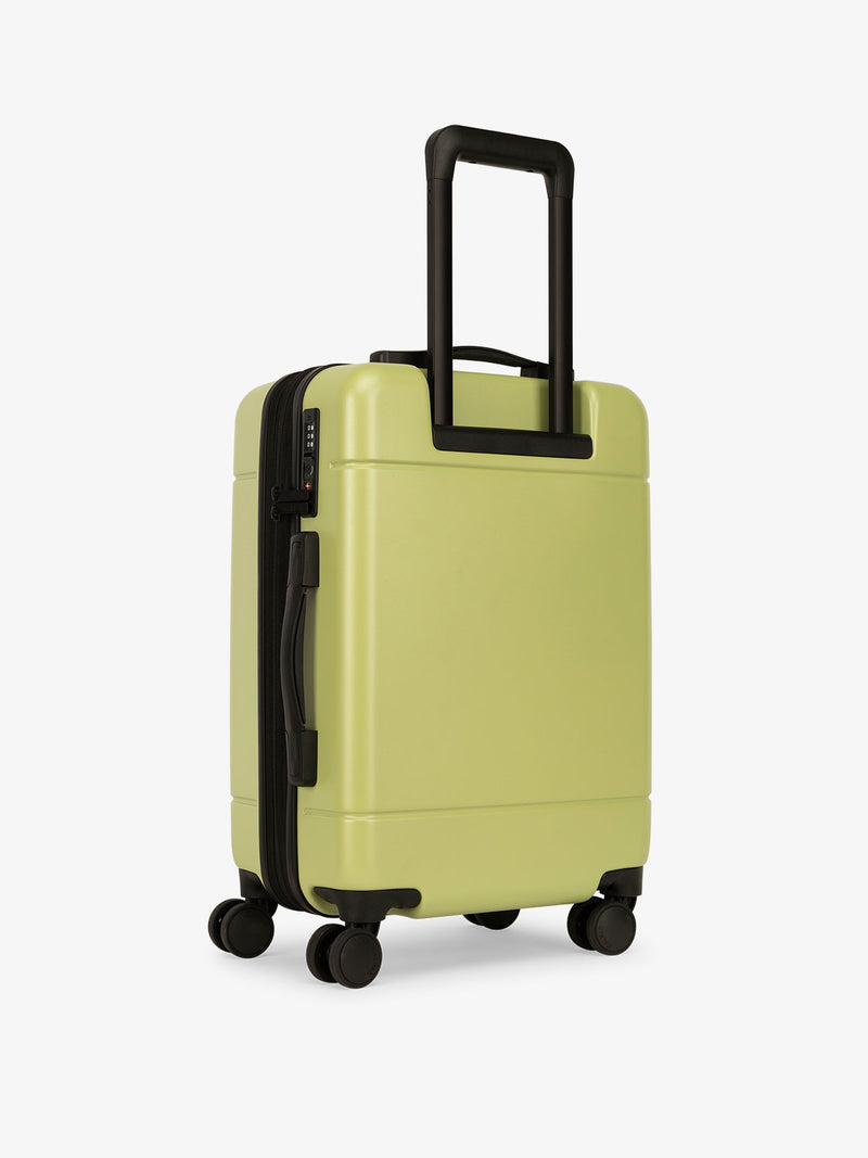 CALPAK Hue lightweight carry-on suitcase with laptop pocket in green key lime color