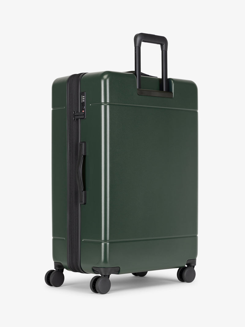 CALPAK Hue Large 30 inch hard shell Luggage back view in green Emerald