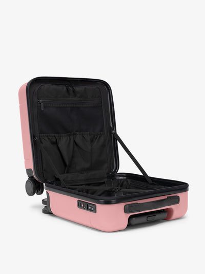 CALPAK Hue small carry-on featuring compression straps in pink mauve