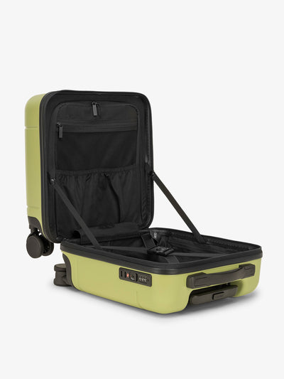 CALPAK Hue small carry-on featuring compression straps in key lime green