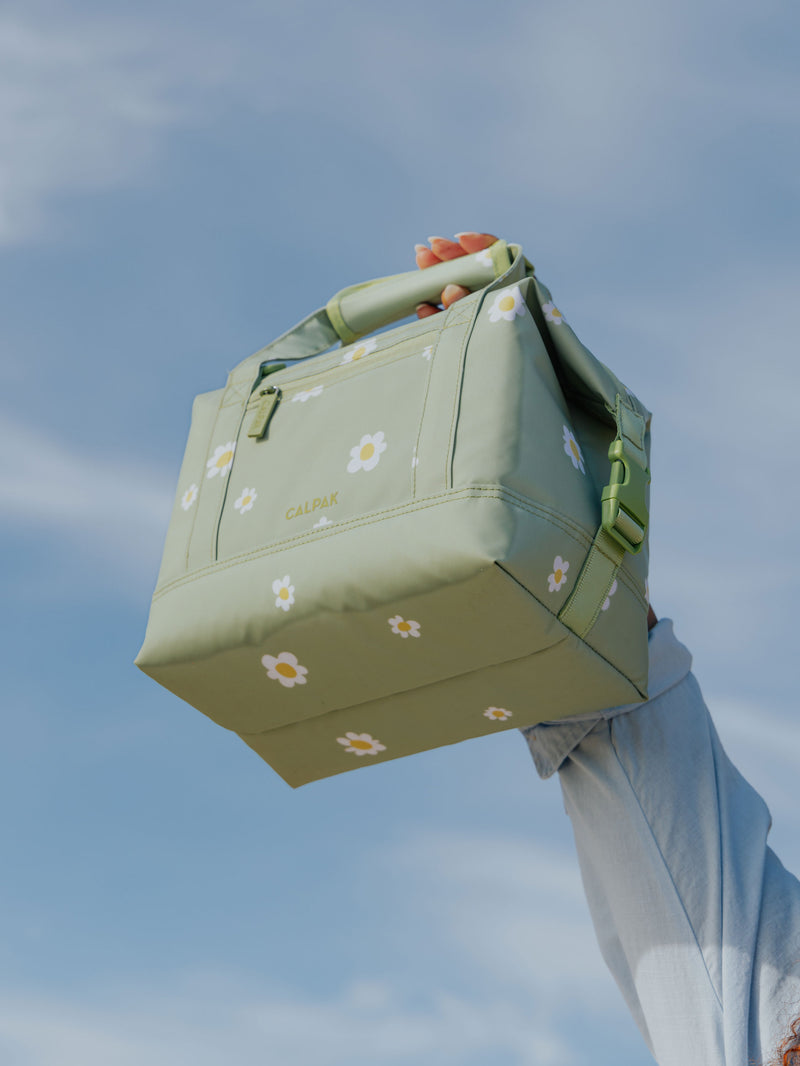 Model holding daisy CALPAK Insulated 8L Soft-Sided Cooler in air