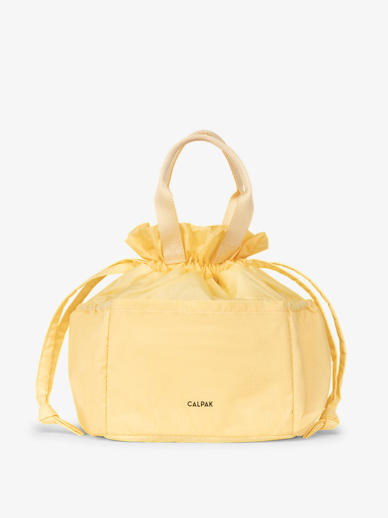 CALPAK insulated lunch bag in yellow lemonade