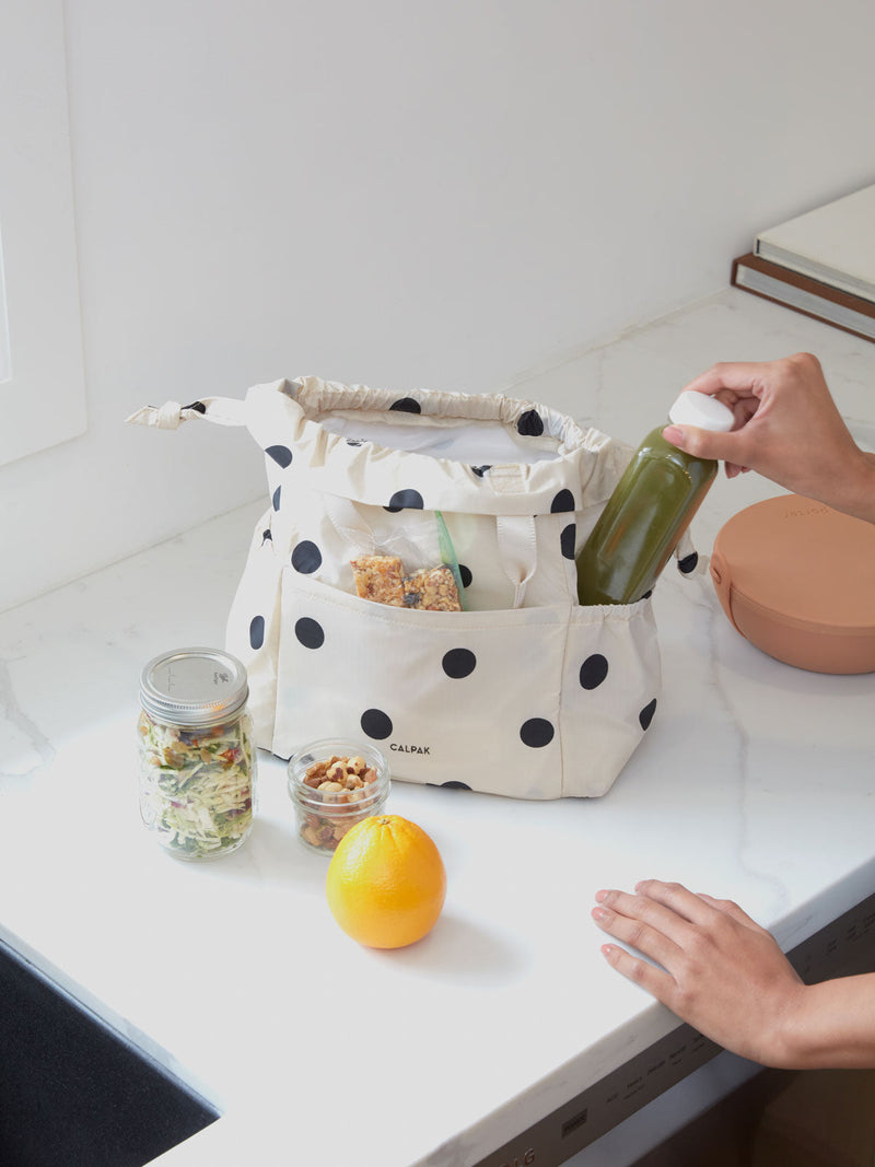 CALPAK insulated black and white polka dotted lunch cooler bag