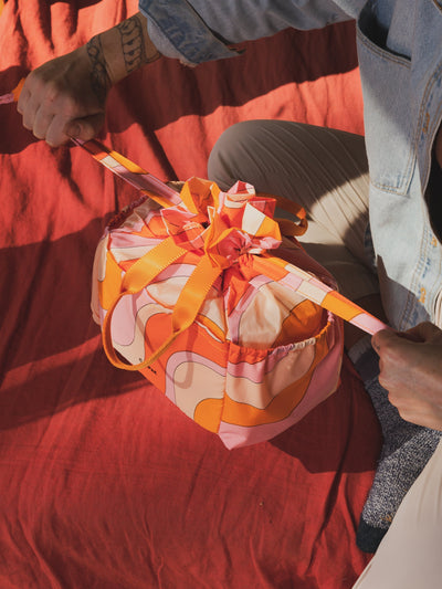 CALPAK Insulated reusable Lunch Bag for outdoor picnics in retro sunset