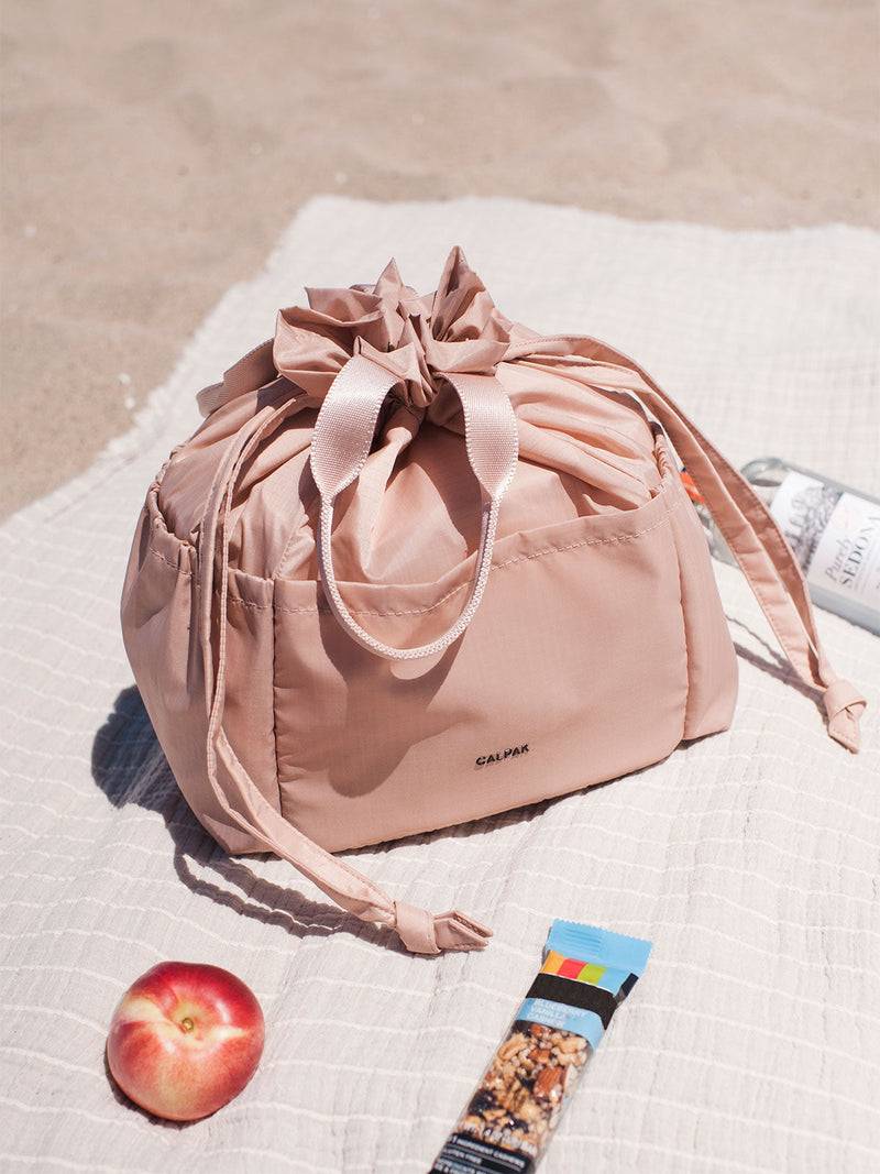 CALPAK insulated lunch bag in pink sand