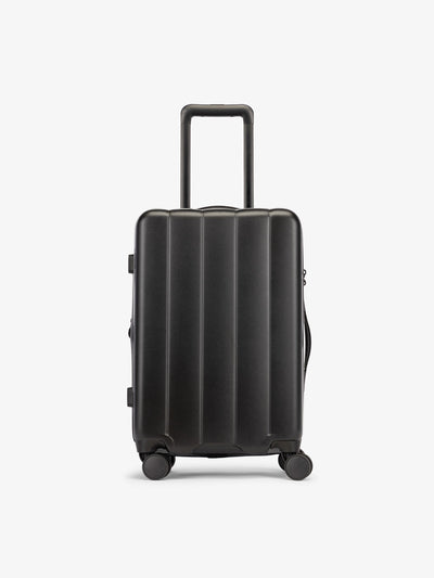 CALPAKs Black carry-on luggage made from an ultra-durable polycarbonate shell and expandable by up to 2"