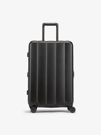 CALPAK Black medium luggage made from an ultra-durable polycarbonate shell and expandable by up to 2