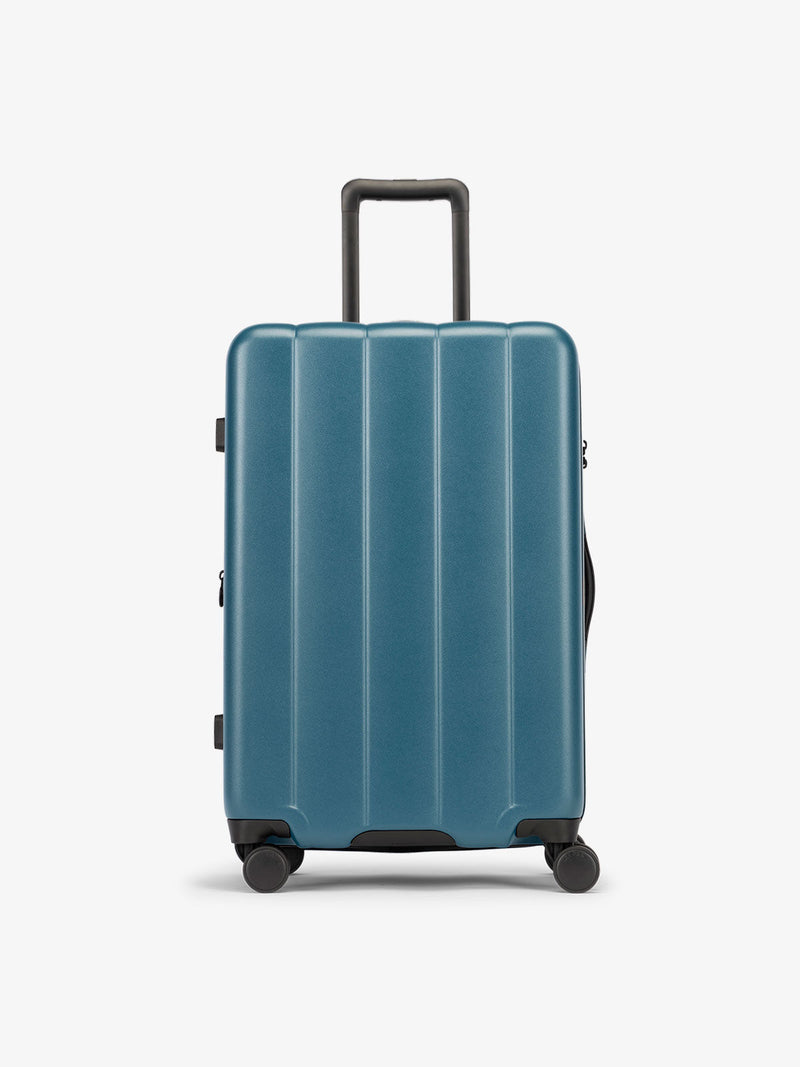 CALPAK Pacific blue medium luggage made from an ultra-durable polycarbonate shell and expandable by up to 2"