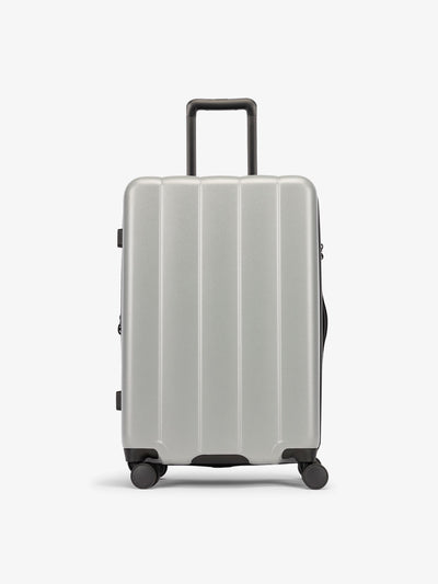 CALPAK Smoke gray medium luggage made from an ultra-durable polycarbonate shell and expandable by up to 2"