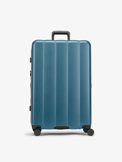 CALPAK Pacific blue large luggage made from an ultra-durable polycarbonate shell and expandable by up to 2