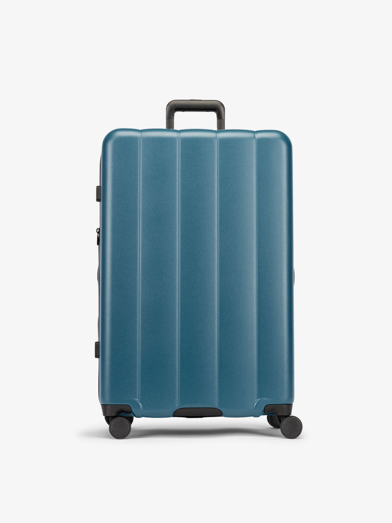 CALPAK Pacific blue large luggage made from an ultra-durable polycarbonate shell and expandable by up to 2"