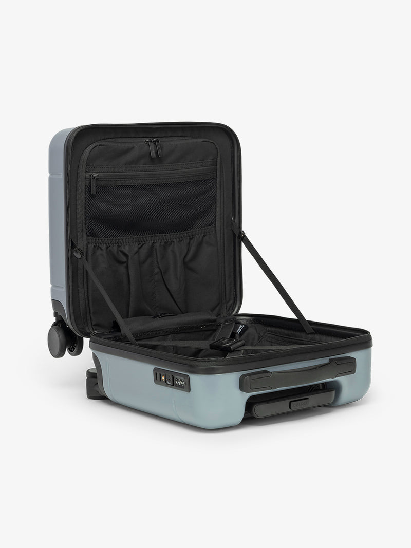 CALPAK Hue Mini Carry-On Luggage in blue Bluebell opened with black interior