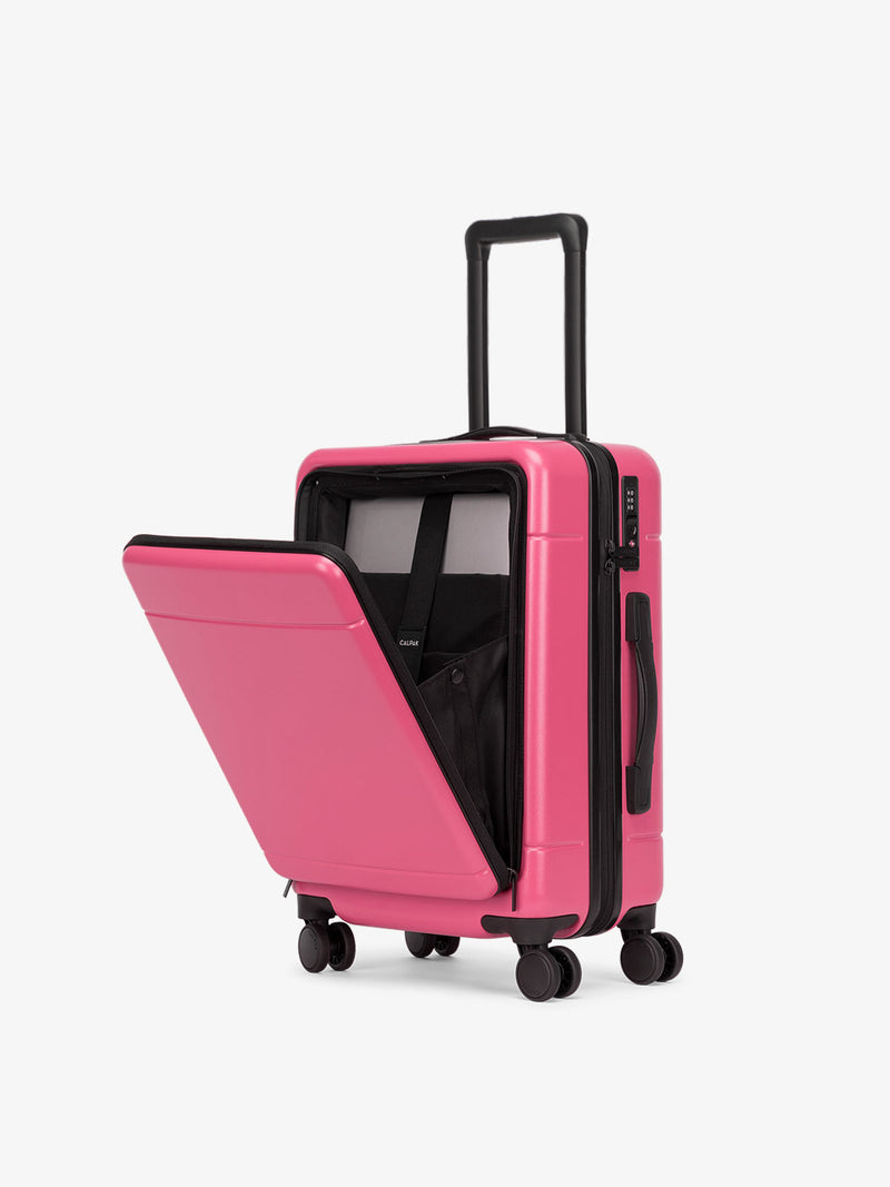 CALPAK Hue carry-on hard shell luggage with front pocket in hot pink dragonfruit